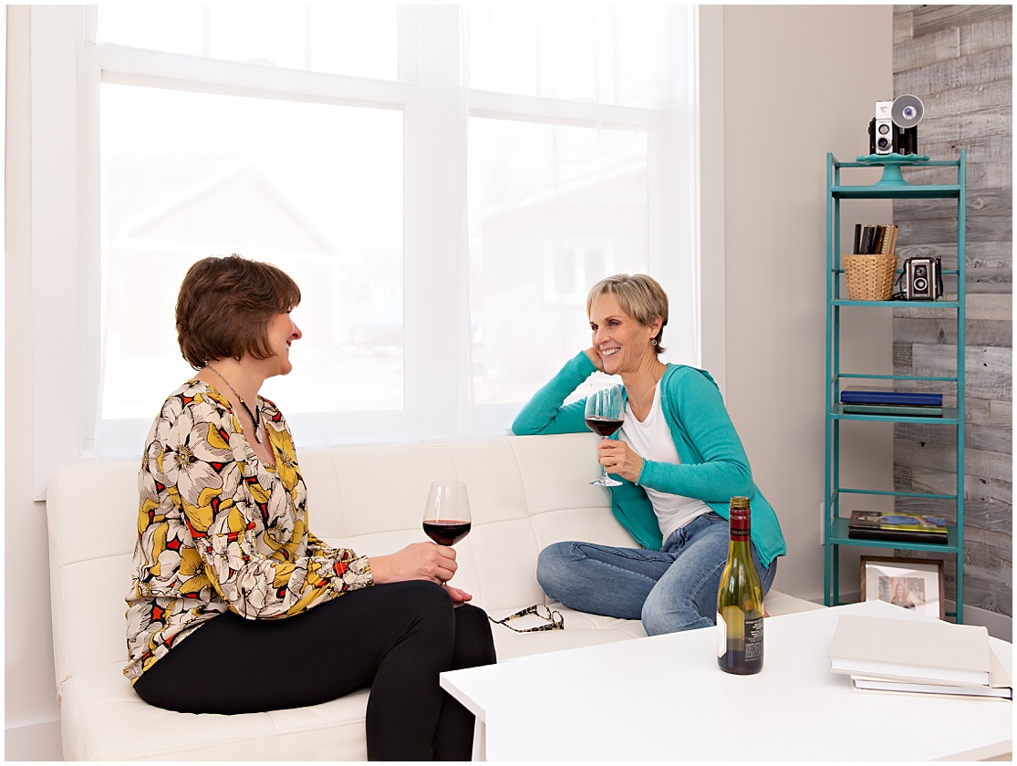 two female entrepreneurs drinking wine