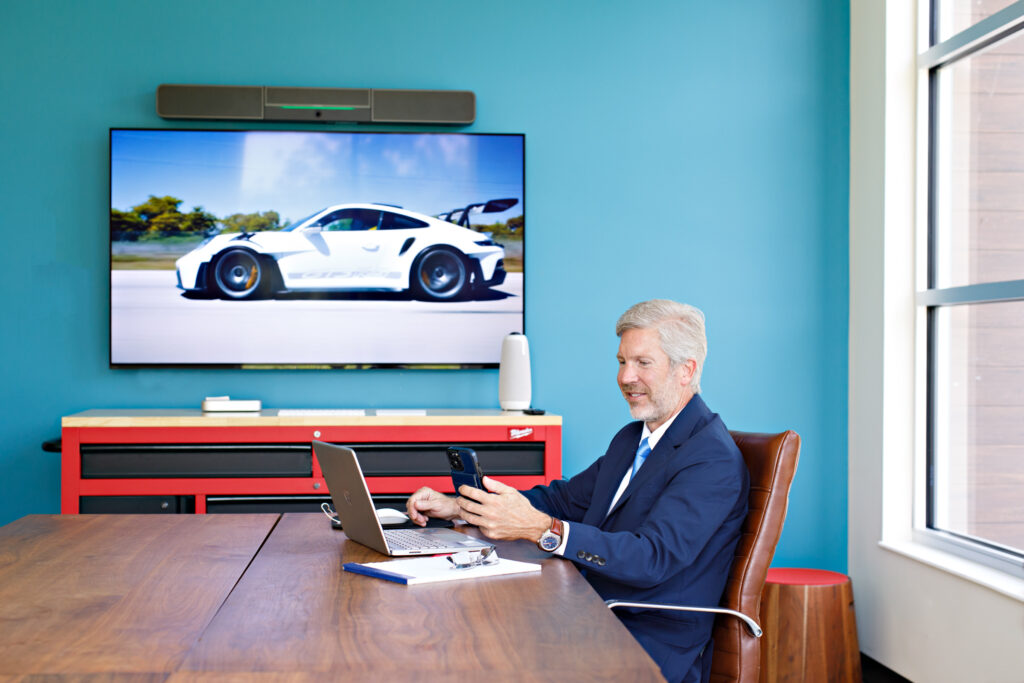 Male entrepreneur in a suit in a board room